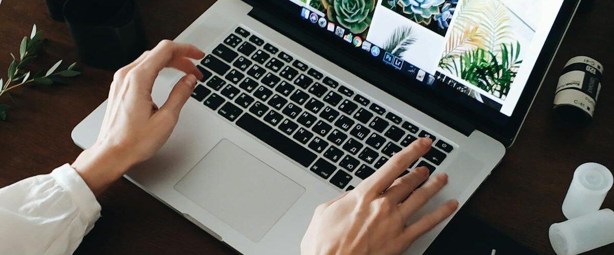 Person working on computer - IT cost analysis