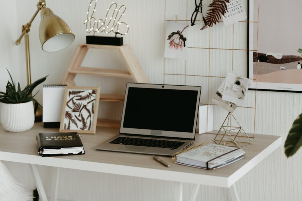 Laptop on wooden desk - sales team laptop guide