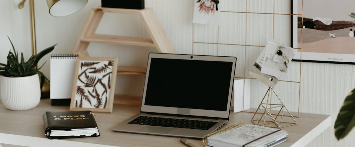 Laptop on wooden desk - sales team laptop guide